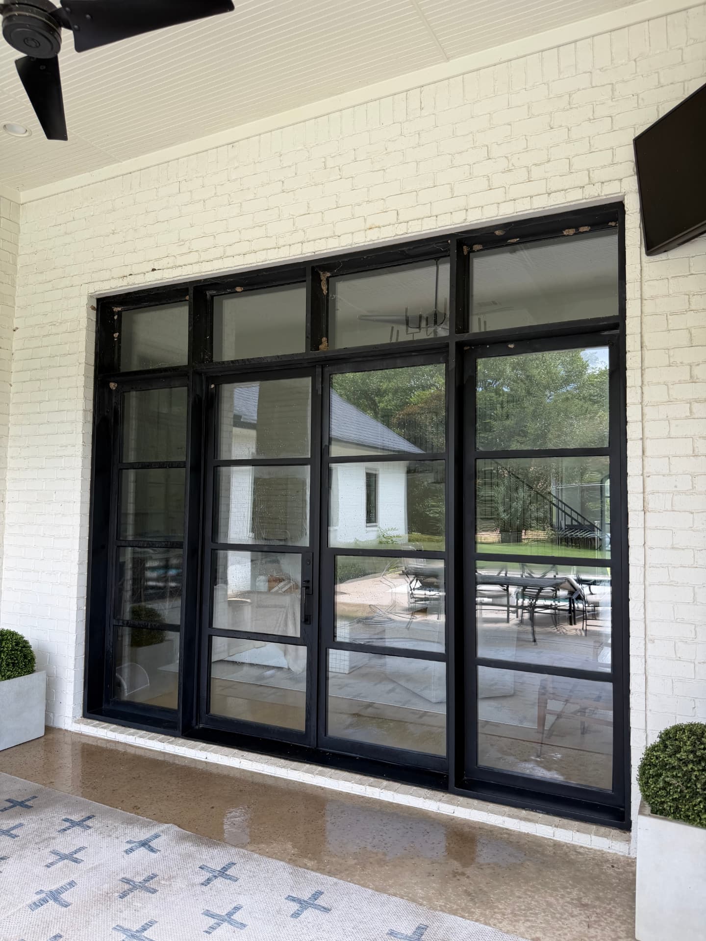 Before — Steel-frame glass door wall before and after window cleaning