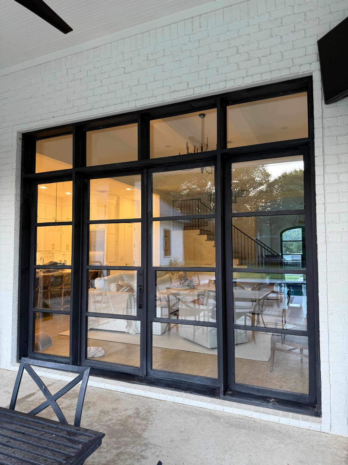 After — Steel-frame glass door wall before and after window cleaning
